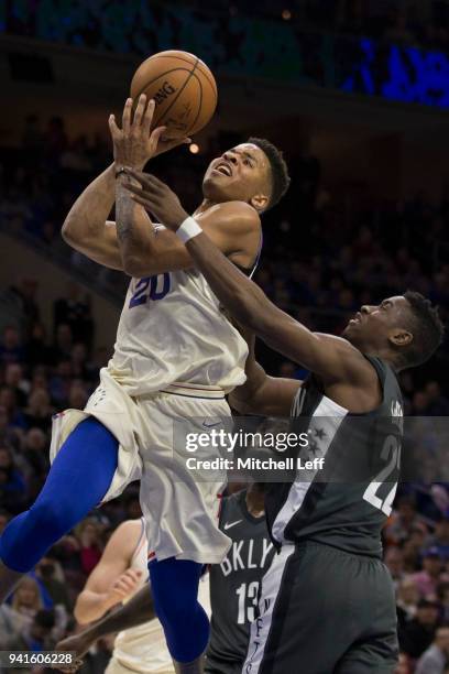 Markelle Fultz of the Philadelphia 76ers goes up for a shot and is fouled by Caris LeVert of the Brooklyn Nets in the third quarter at the Wells...