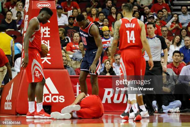 Ryan Anderson of the Houston Rockets injures his leg in the first half against the Washington Wizards at Toyota Center on April 3, 2018 in Houston,...