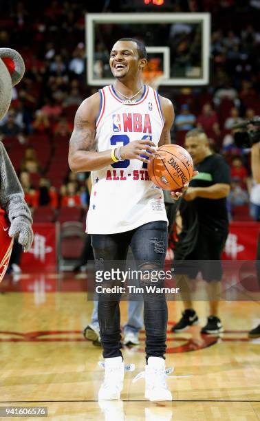 Deshaun Watson of the Houston Texans shoots from the floor before the game between the Houston Rockets and the Washington Wizards at Toyota Center on...