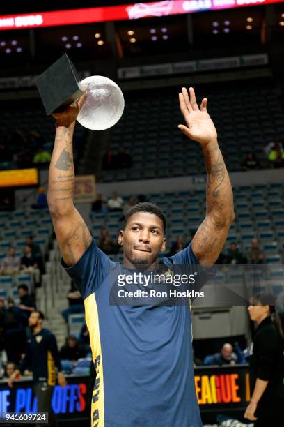 DeQuan Jones of the Fort Wayne Mad Ants raises his Most Improved Player Award prior to the Mad Ants taking on the Erie Bayhawks in the 2018 Eastern...