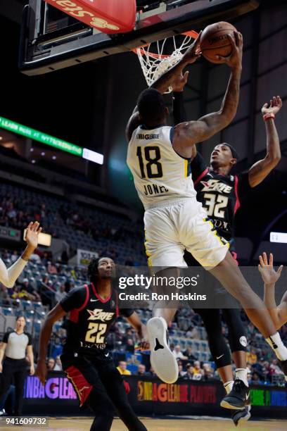DeQuan Jones of the Fort Wayne Mad Ants battles Craig Sword of the Erie Bayhawks in the 2018 Eastern Conference semi-finals of the NBA G League on...