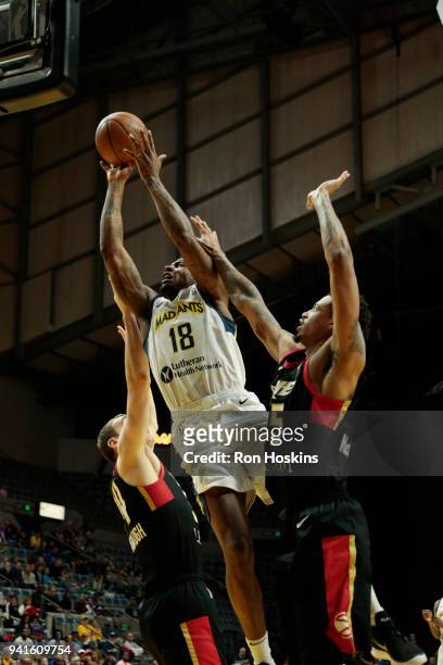 Dequan Jones of the Fort Wayne Mad Ants battles Chris McCullough of the Erie Bayhawks in the 2018 Eastern Conference semi-finals of the NBA G League...