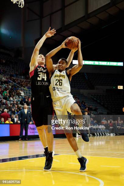 Ben Moore of the Fort Wayne Mad Ants battles Tyler Cavanaugh of the Erie Bayhawks in the 2018 Eastern Conference semi-finals of the NBA G League on...