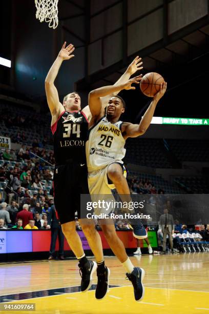 Ben Moore of the Fort Wayne Mad Ants battles Tyler Cavanaugh of the Erie Bayhawks in the 2018 Eastern Conference semi-finals of the NBA G League on...