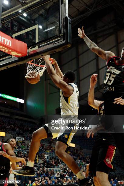 Ike Anigbogu of the Fort Wayne Mad Ants jams over Chris McCullough of the Erie Bayhawks in the 2018 Eastern Conference semi-finals of the NBA G...