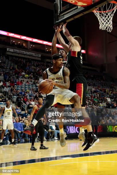 Walt Lemon Jr of the Fort Wayne Mad Ants battles two Erie Bayhawks defenders in the 2018 Eastern Conference semi-finals of the NBA G League on April...