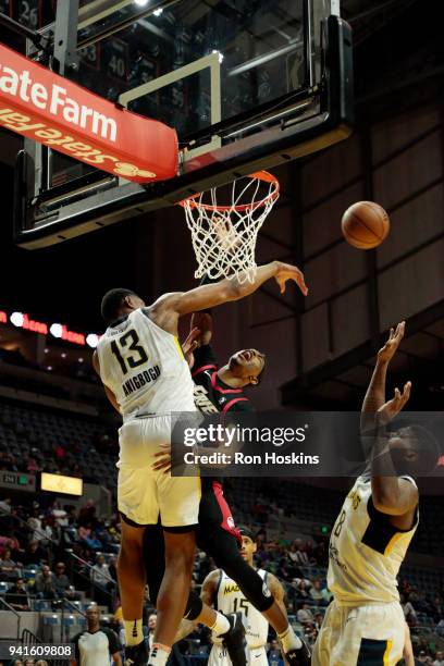 Ike Anigbogu of the Fort Wayne Mad Ants battles Craig Sword of the Erie Bayhawks in the 2018 Eastern Conference semi-finals of the NBA G League on...
