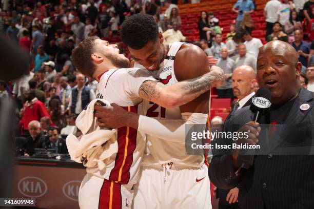Tyler Johnson and Hassan Whiteside of the Miami Heat hug after the game against the Atlanta Hawks on April 3, 2018 at American Airlines Arena in...