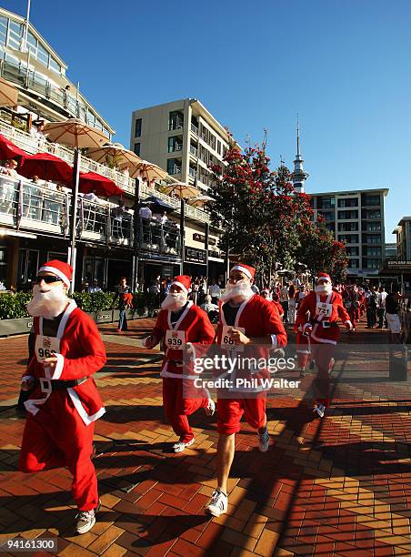 Competitors in the Great New Zealand Santa Run jog through the Viaduct Harbour on December 9, 2009 in Auckland, New Zealand. The run was held in an...