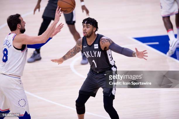Brooklyn Nets Guard D'Angelo Russell defends Philadelphia 76ers Forward Marco Belinelli as he makes a pass in the first half during the game between...