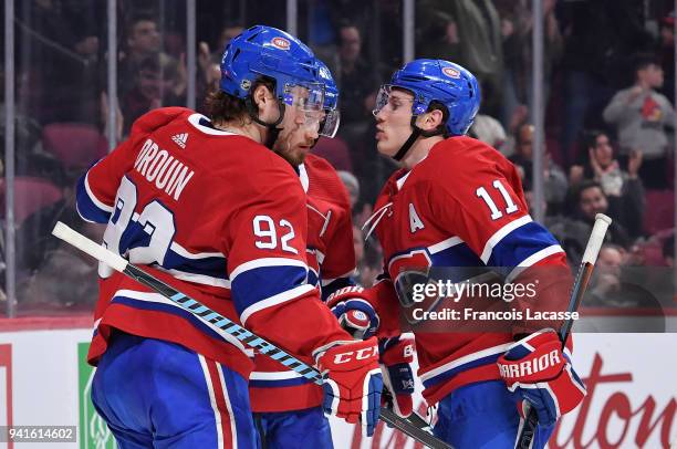 Paul Byron of the Montreal Canadiens celebrates with teammates after scoring a goal against the Winnipeg Jets in the NHL game at the Bell Centre on...