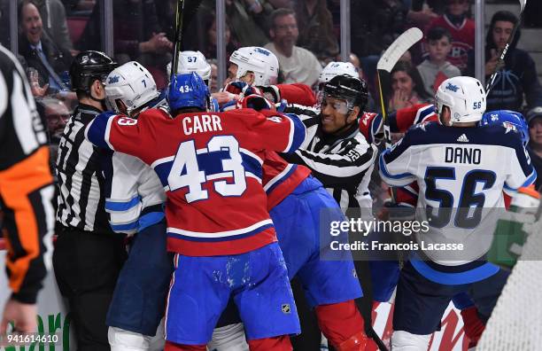 Montreal Canadiens' players get into a scrum with Winnipeg Jets' players in the NHL game at the Bell Centre on April 3, 2018 in Montreal, Quebec,...