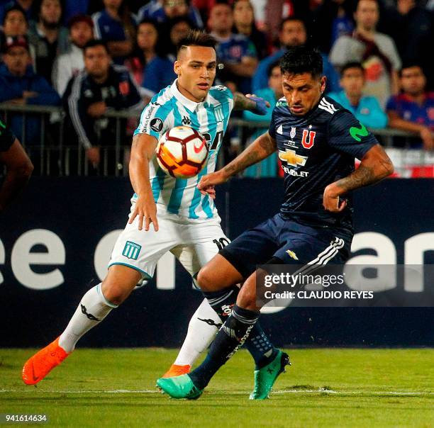 Chile's Universidad de Chile player Gonzalo Jara vies for the ball with Argentina's Racing Club forward Lautaro Martinez during their Copa...