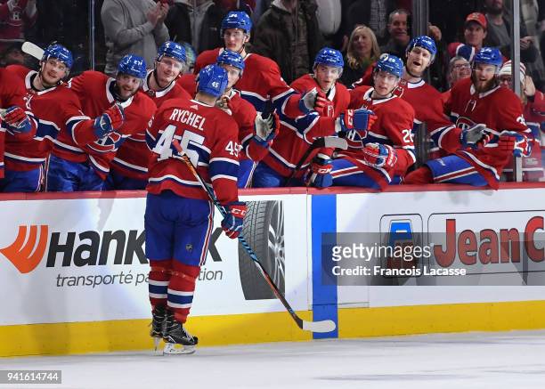 Kerby Rychel of the Montreal Canadiens celebrates with the bench after scoring a goal against the Winnipeg Jets in the NHL game at the Bell Centre on...
