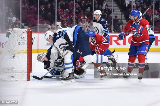Paul Byron of the Montreal Canadiens celebrates the goal scored by Alex Galchenyuk against the Winnipeg Jets in the NHL game at the Bell Centre on...