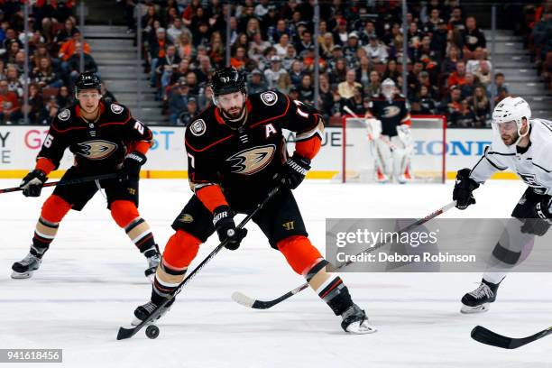 Ryan Kesler of the Anaheim Ducks skates with the puck against Tobias Rieder of the Los Angeles Kings with help from Brandon Montour during the game...