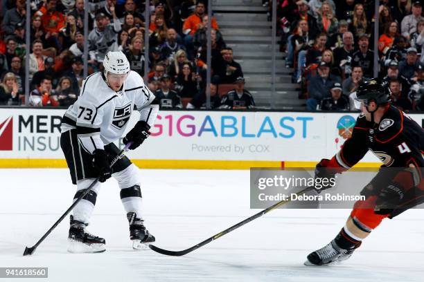 Tyler Toffoli of the Los Angeles Kings skates with the puck with pressure from Cam Fowler of the Anaheim Ducks during the game on March 30, 2018 at...