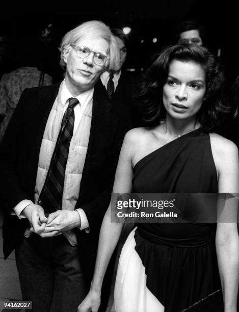 Andy Warhol and Bianca Jagger wearing Halston attend Gala Honoring George Cukor on April 30, 1978 at Lincoln Center in New York City.