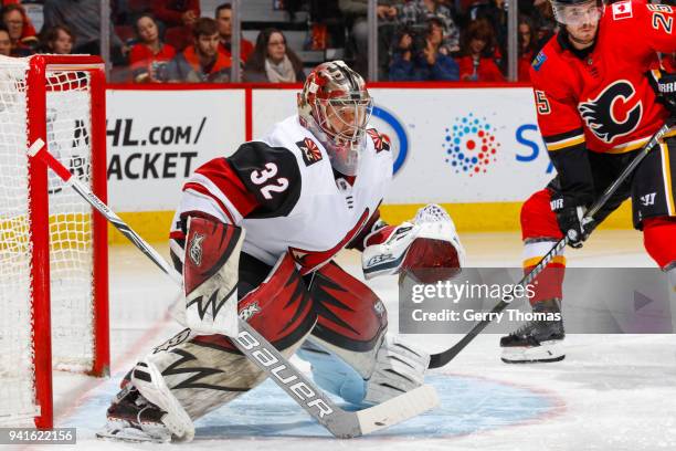 Antti Raanta of the Arizona Coyotes guards the net in an NHL game on April 3, 2018 at the Scotiabank Saddledome in Calgary, Alberta, Canada.