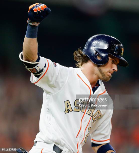 Josh Reddick of the Houston Astros hits a grand slam in the seventh inning against the Baltimore Orioles at Minute Maid Park on April 3, 2018 in...