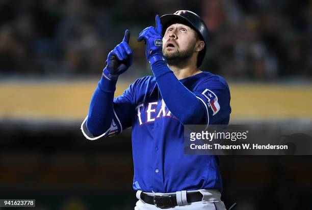 Joey Gallo of the Texas Rangers celebrates after hitting a solo home run against the Oakland Athletics in the top of the third inning at the Oakland...