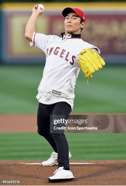 Japanese professional racing driving and Indy 500 winner Takuma Sato throws out the first pitch before a game between the Cleveland Indians and the...