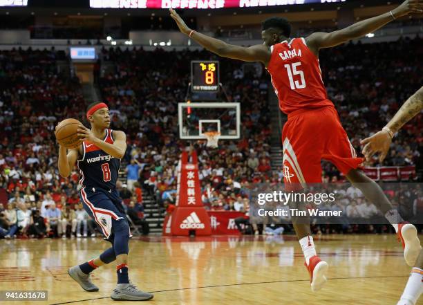 Tim Frazier of the Washington Wizards looks to pass against Clint Capela of the Houston Rockets in the second half at Toyota Center on April 3, 2018...