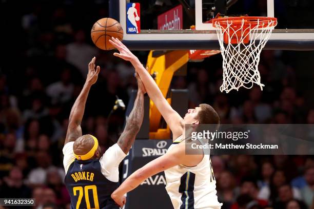 Trevor Booker of the Indiana Pacers is blocked going to the basket by Nikola Jokic of the Denver Nuggets at the Pepsi Center on April 3, 2018 in...