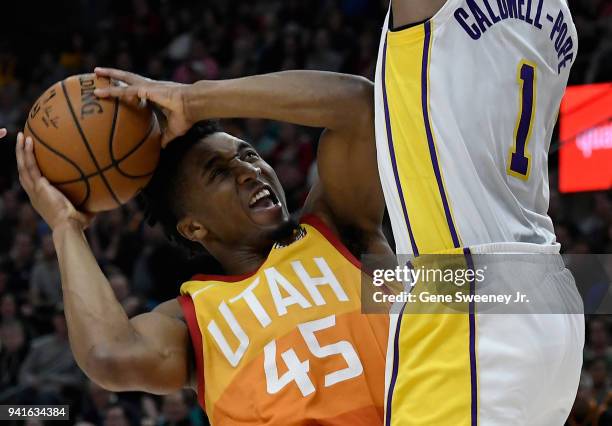 Donovan Mitchell of the Utah Jazz is guarded by Kentavious Caldwell-Pope of the Los Angeles Lakers in the second half of a game at Vivint Smart Home...