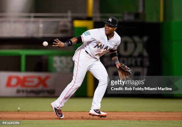 Starlin Castro of the Miami Marlins turns a double play during the game against the Boston Red Sox at Marlins Park on April 3, 2018 in Miami, Florida.