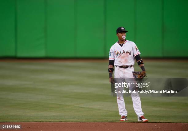 Starlin Castro of the Miami Marlins blows a bubble during the game against the Boston Red Sox at Marlins Park on April 3, 2018 in Miami, Florida.