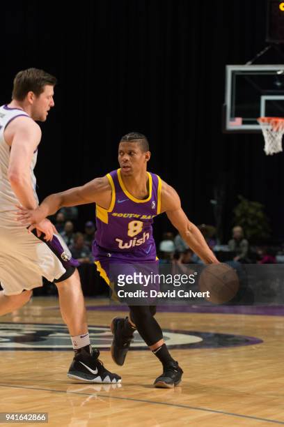 Scott Machado of the South Bay Lakers dribbles around Jack Cooley of the Reno Bighorns during an NBA G-League game on April 3, 2018 at the Reno...