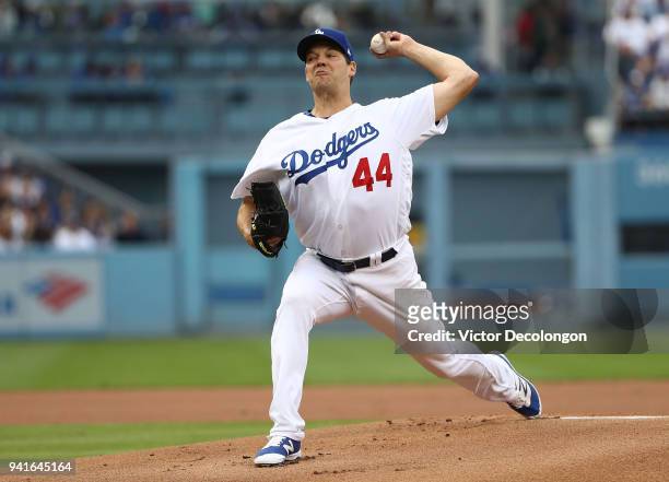 Pitcher Rich Hill of the Los Angeles Dodgers pitches during the first inning of the MLB game against the San Francisco Giants at Dodger Stadium on...