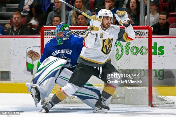 Ryan Reaves of the Vegas Golden Knights collides with Jacob Markstrom of the Vancouver Canucks during their NHL game at Rogers Arena April 3, 2018 in...