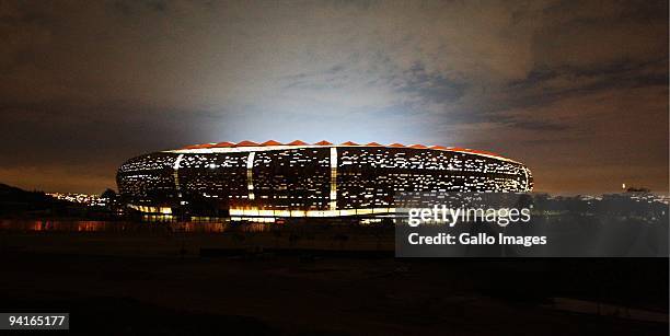 The flood lights of the Soccer City Stadium in Diepkloof are officially switched on December 8, 2009 in Johannesburg, South Africa. Soccer City is...