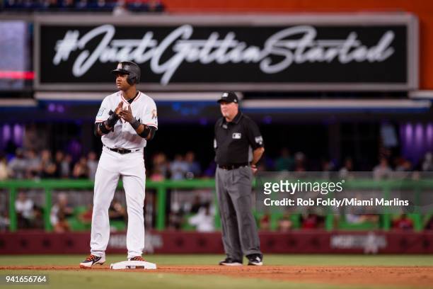 Starlin Castro of the Miami Marlins claps after hitting a double during the game against the Boston Red Sox at Marlins Park on April 2, 2018 in...