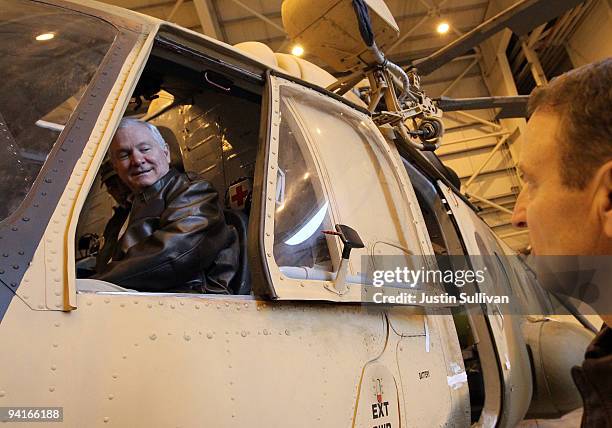 Secretary of Defense Robert Gates sits in a helicopter while visiting a NATO aviation training facility at Kabul International Airport December 9,...