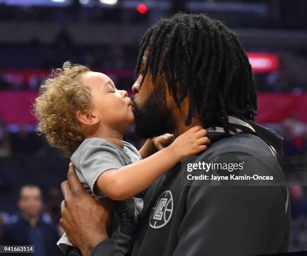 DeAndre Jordan of the Los Angeles Clippers holds his two-year-old son Jaden Jordan before the game against the San Antonio Spurs at Staples Center on...