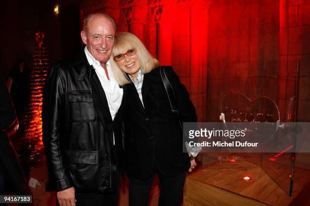 Pascal Desprez and Mireille Darc attend the Designers Christmas Trees Charity Auction For Carla Bruni Foundation on December 8, 2009 in Paris, France.