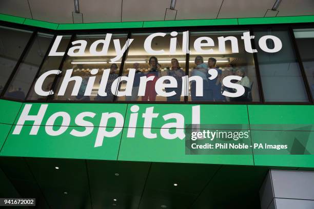 People wait for the arrival of the Prince of Wales and the Duchess of Cornwall at the Lady Cilento Children's Hospital in Brisbane, Australia.