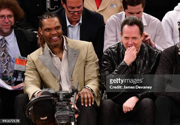 Latrell Sprewell and Dean Winters attend New York Knicks Vs Orlando Magic game at Madison Square Garden on April 3, 2018 in New York City.