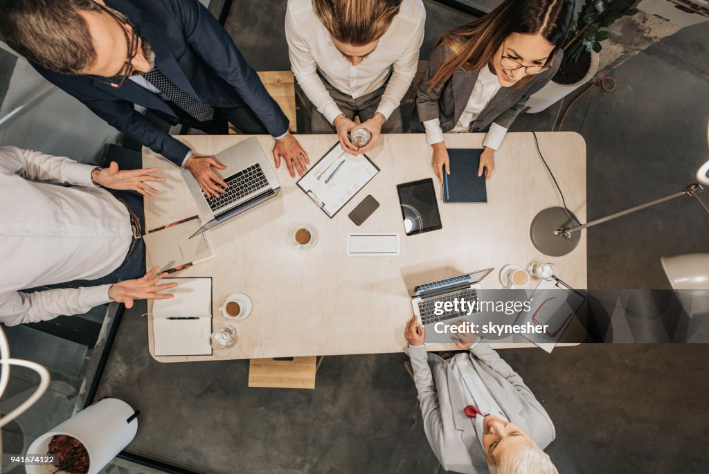 Above view of business team having a talk in the office.