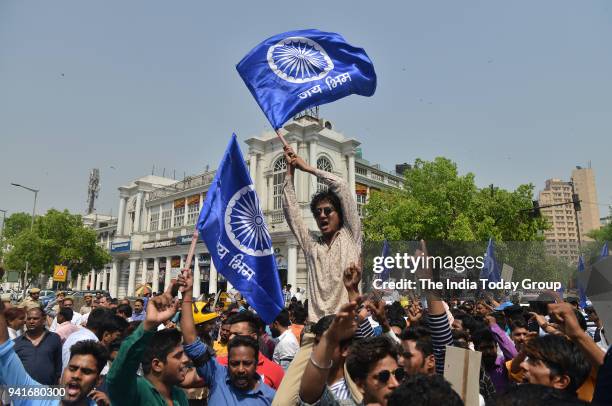 Members of Dalit community stage a protest during 'Bharat Bandh' call by Dalit organisations against the alleged dilution of Scheduled Castes /...