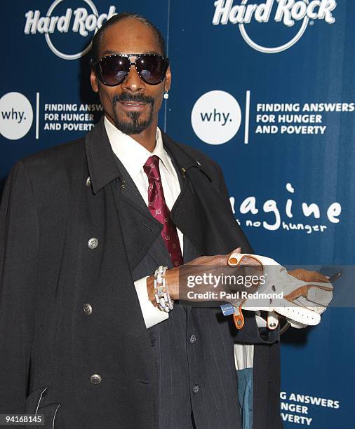 Musician Snoop Dogg attends CD signing of "Malice N Wonderland" and donates memorabilia to Hard Rock Cafe Hollywood on December 8, 2009 in Los...