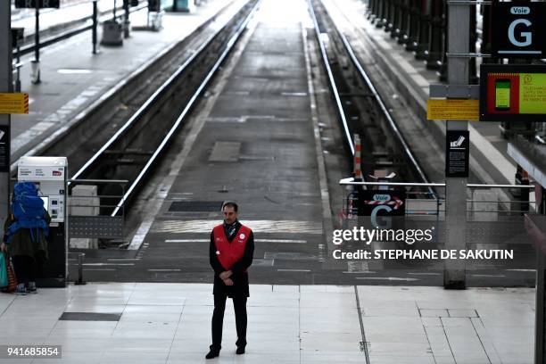 Staff of French public railways service SNCF is pictured at Gare de Lyon train station in Paris on April 4 on the second day of three months of...