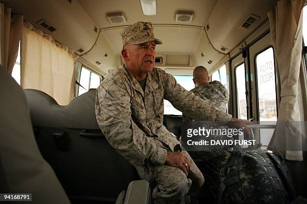 Major General Douglas M. Stone, Deputy Commanding General, Detainee Operations, Multi-National Force-Iraq and Commander, Task Force 134, rides on a...