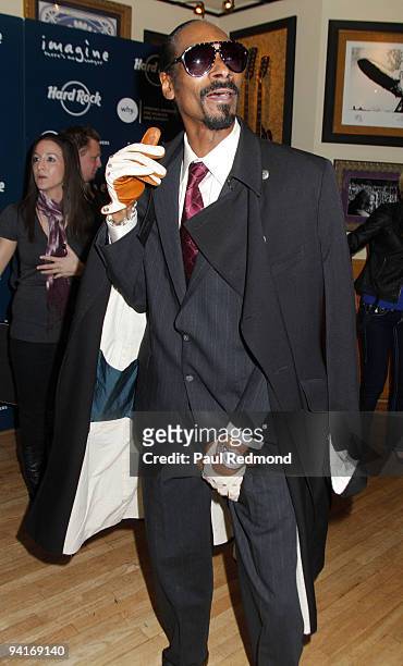 Musician Snoop Dogg attends CD signing of "Malice N Wonderland" and donates memorabilia to Hard Rock Cafe Hollywood on December 8, 2009 in Los...