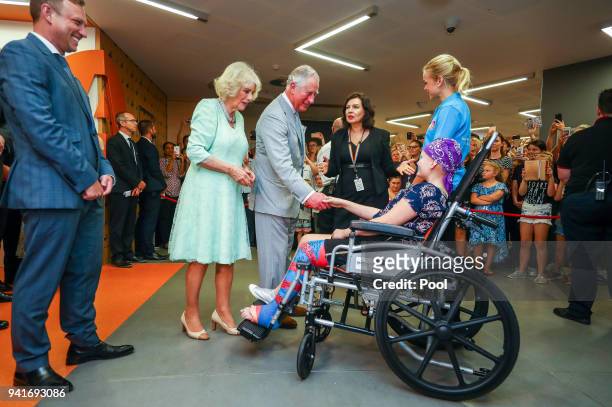 Prince Charles, Prince of Wales and Camilla, Duchess of Cornwall greet Abbi Head - 13 of Brisbane during an official visit to the Lady Cilento...