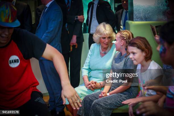 Camilla, Duchess of Cornwall talks with patients while watching a performance at the Starlight room during an official visit to the Lady Cilento...