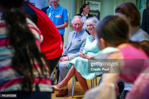 Prince Charles, Prince of Wales and Camilla, Duchess of Cornwall watch a performance at the Starlight room during an official visit to the Lady...